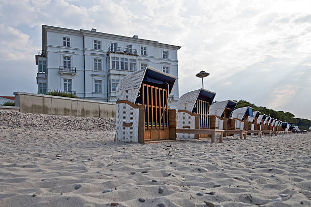 "Vacant beach chairs at the coast of the Baltic Sea in the seaside resort Heiligendamm (Meckenburg-Vorpommern, Germany) just before a thunderstorm."